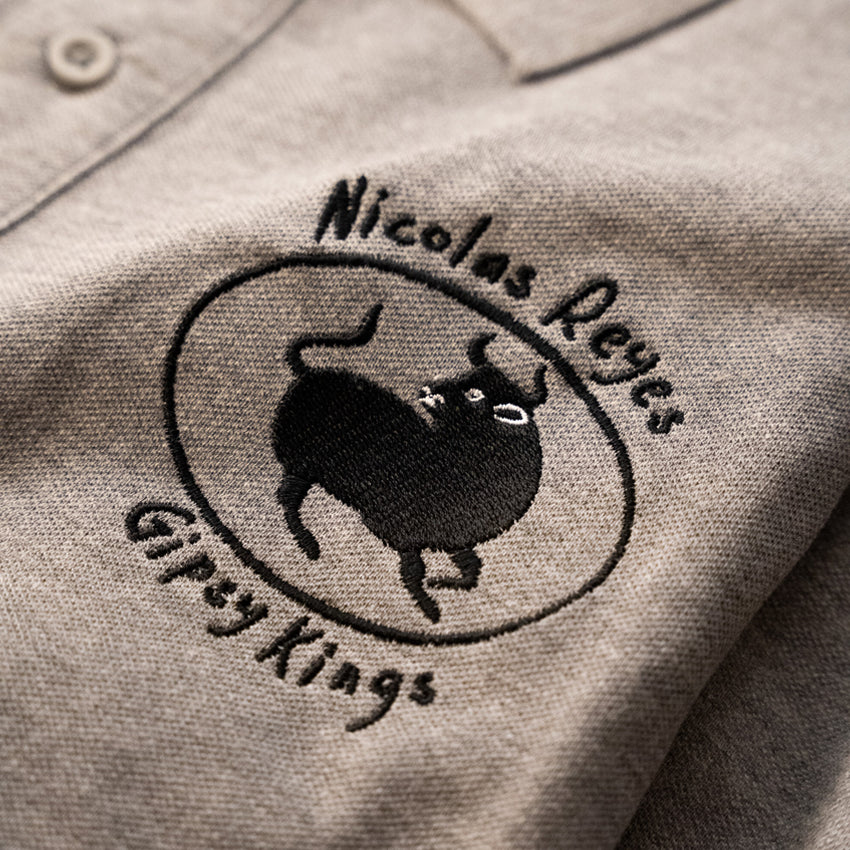 Polo gris brodé BULL Nicolas Reyes